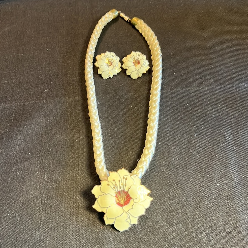 Floral enamel pendant on rope necklace with a pair of white gold tone earrings